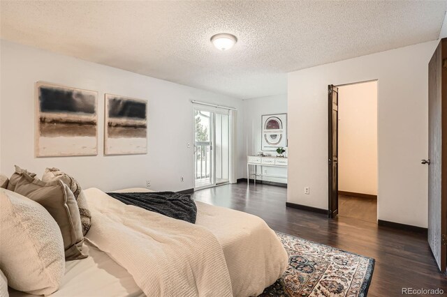bedroom with access to outside, a textured ceiling, baseboards, and dark wood-style floors