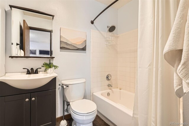 full bathroom featuring vanity, toilet, and shower / bath combination with curtain