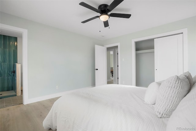 bedroom with ensuite bath, ceiling fan, and light hardwood / wood-style floors