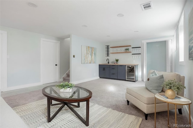 living room with wine cooler and bar