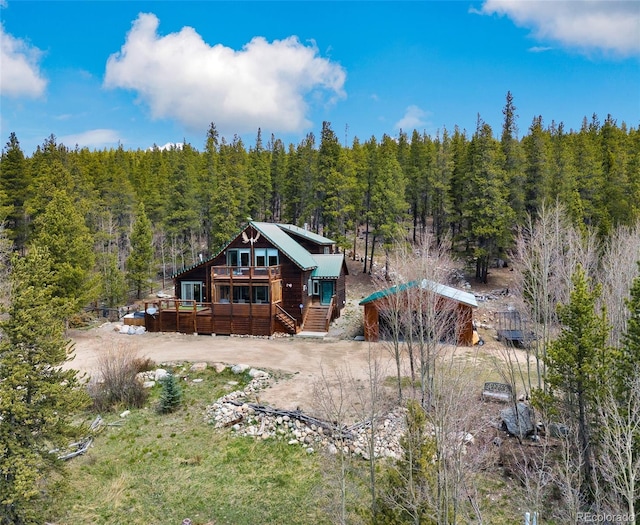 2891 Nugget Rd, Fairplay, CO 80440 - rear view of property with a wooded view and a deck
