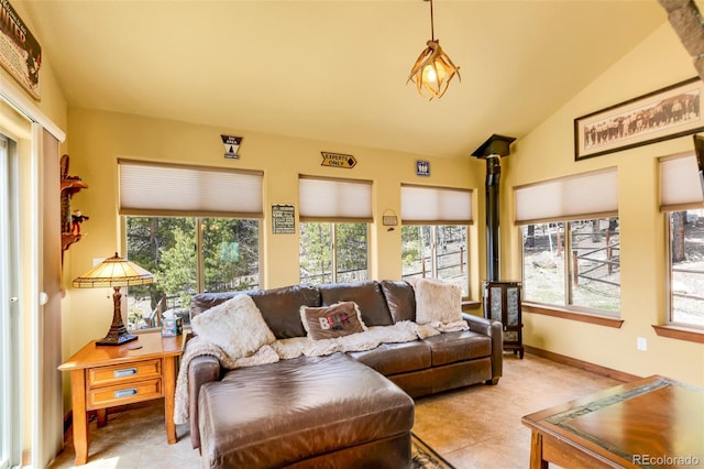 2891 Nugget Rd, Fairplay, CO 80440 - living room featuring plenty of natural light, light tile patterned flooring, lofted ceiling, and baseboards