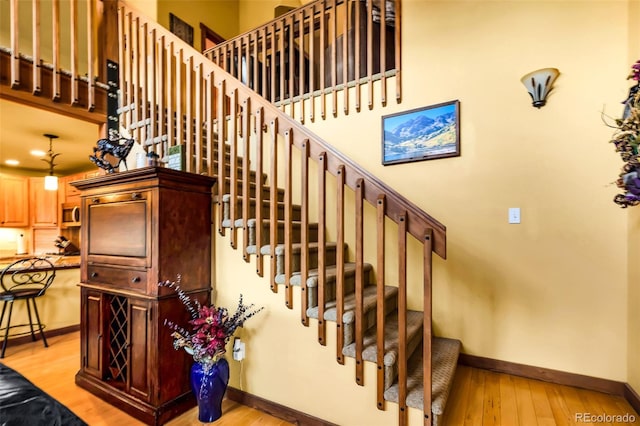 2891 Nugget Rd, Fairplay, CO 80440 - staircase featuring baseboards and wood finished floors