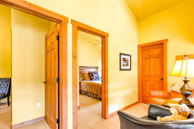 2891 Nugget Rd, Fairplay, CO 80440 - corridor with light carpet, baseboards, and high vaulted ceiling