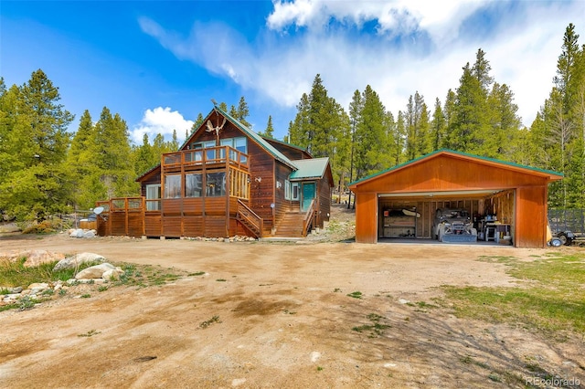 2891 Nugget Rd, Fairplay, CO 80440 - view of front of property with a garage, an outbuilding, and a wooden deck