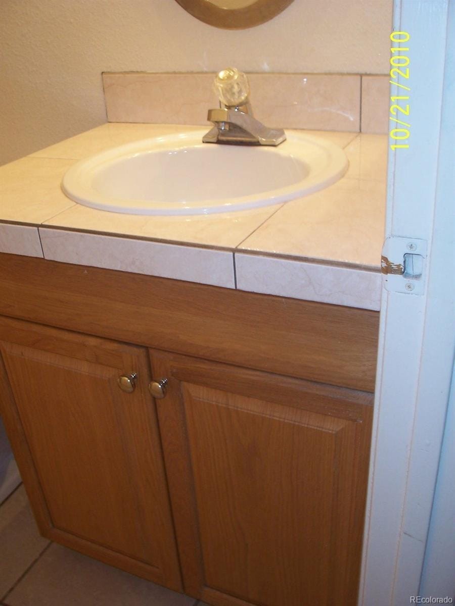 10742 E Exposition Ave Unit 124, Aurora, CO 80012 - bathroom featuring vanity