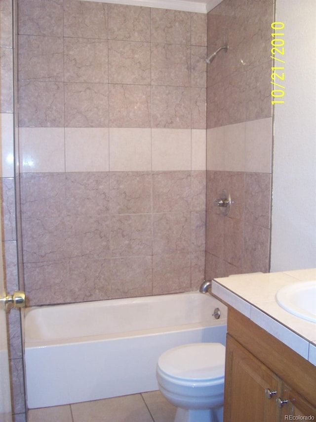10742 E Exposition Ave Unit 124, Aurora, CO 80012 - bathroom featuring tile patterned floors, toilet, bathing tub / shower combination, and vanity