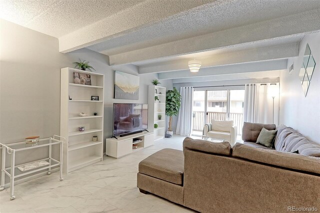 living room featuring beam ceiling and a textured ceiling