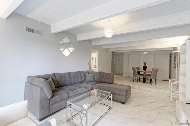 tiled living room featuring beamed ceiling and a textured ceiling