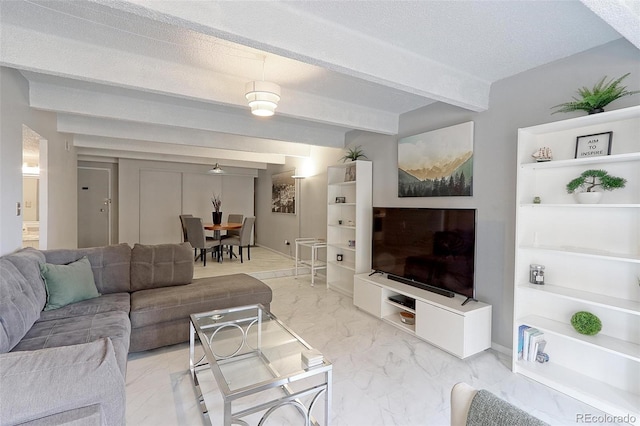 tiled living room with a textured ceiling and beamed ceiling