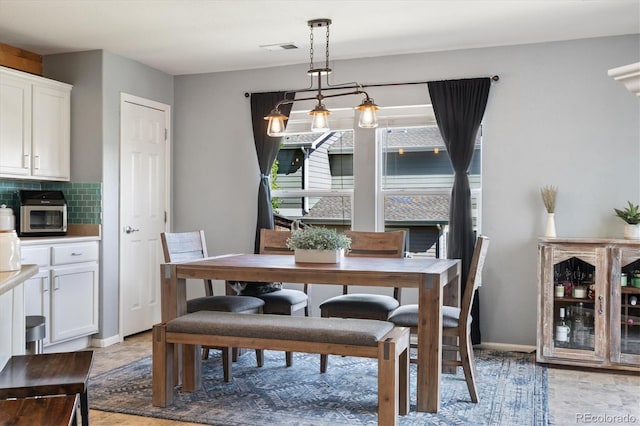 dining room featuring baseboards