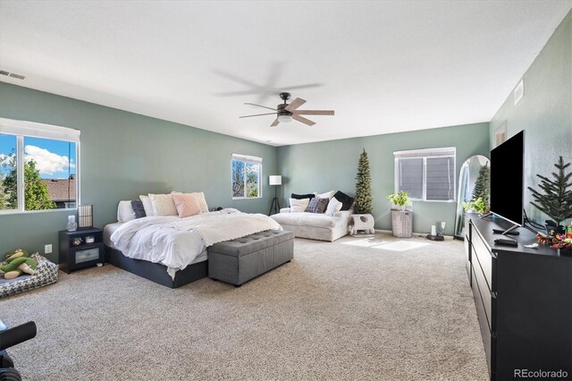 carpeted bedroom featuring a ceiling fan
