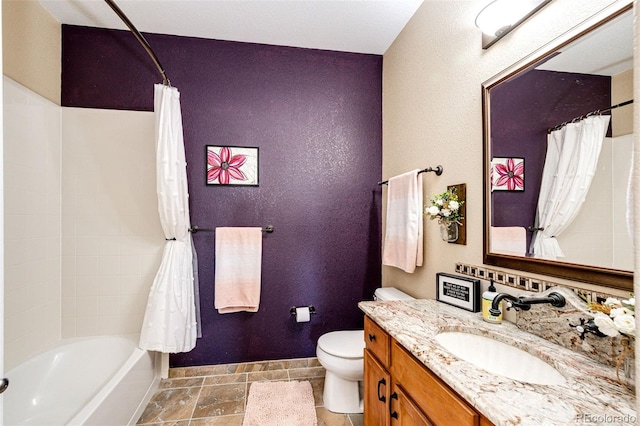 full bathroom featuring toilet, shower / tub combo, and vanity