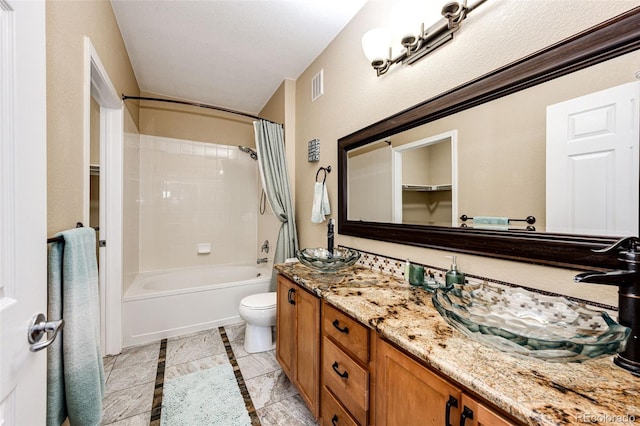 full bathroom with toilet, vanity, and shower / tub combo with curtain