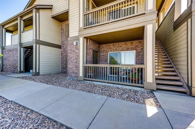 doorway to property featuring a balcony