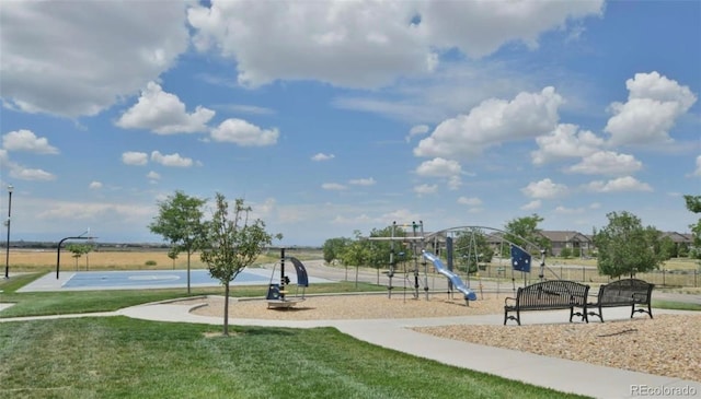 surrounding community with a playground, a yard, and basketball court