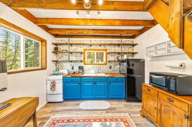 495 Georgia Pass, Jefferson, CO 80456 - kitchen featuring black appliances, blue cabinets, butcher block counters, open shelves, and beam ceiling