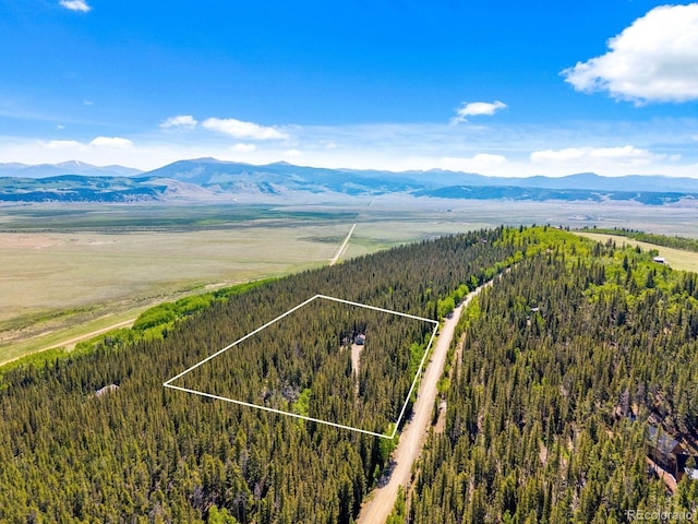 495 Georgia Pass, Jefferson, CO 80456 - aerial view of property and surrounding area featuring mountains and property boundaries highlighted