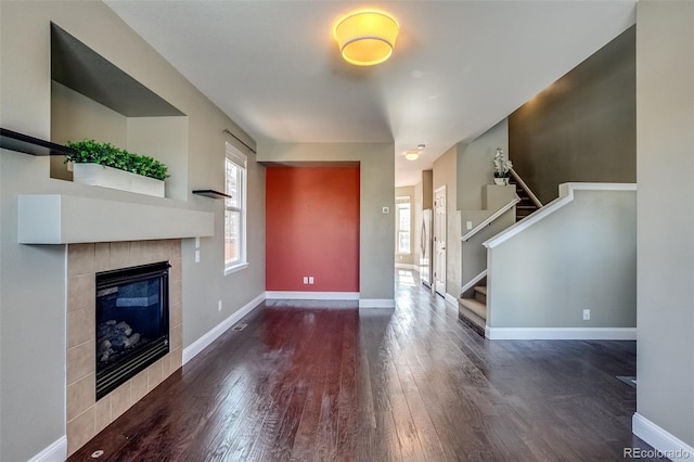 interior space featuring a fireplace and dark hardwood / wood-style flooring