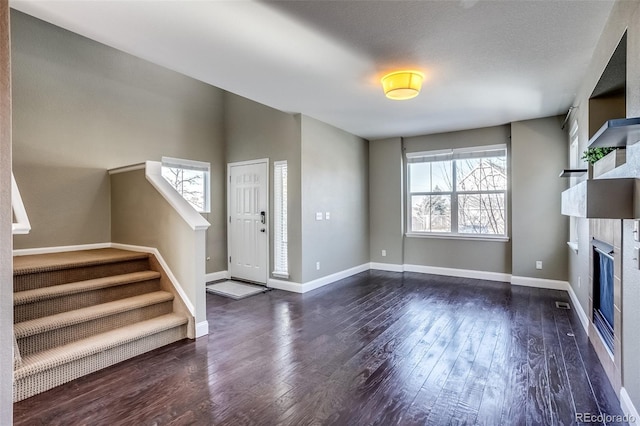 entrance foyer featuring dark hardwood / wood-style flooring