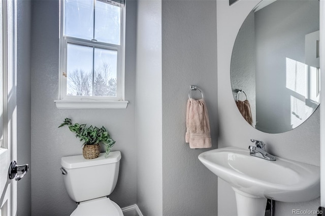 bathroom with sink and toilet