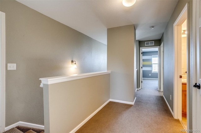 corridor with carpet flooring