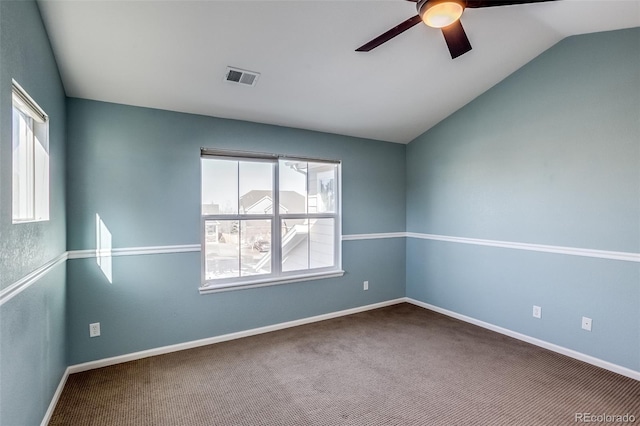 carpeted empty room featuring ceiling fan and lofted ceiling