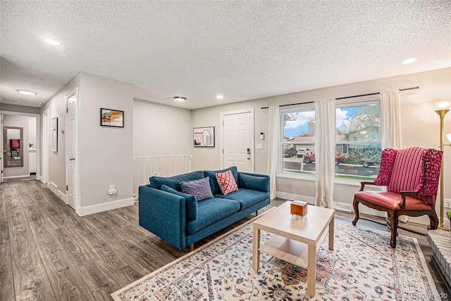 7005 Zenobia Pl, Westminster, CO 80030 - living room featuring a textured ceiling, baseboards, recessed lighting, and wood finished floors