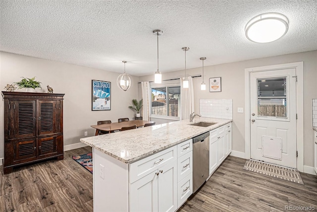 7005 Zenobia Pl, Westminster, CO 80030 - kitchen with a peninsula, dark wood finished floors, a sink, and dishwasher