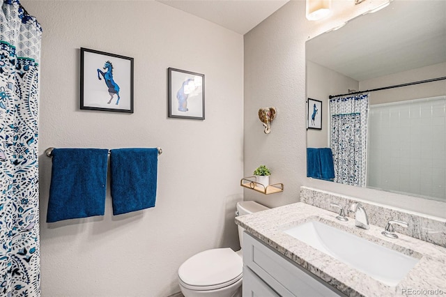 7005 Zenobia Pl, Westminster, CO 80030 - full bath featuring toilet, a textured wall, a shower with shower curtain, and vanity