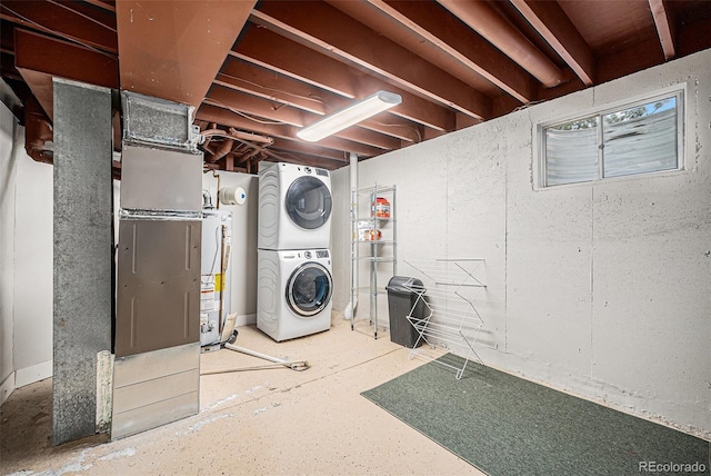 7005 Zenobia Pl, Westminster, CO 80030 - clothes washing area with laundry area, stacked washer / dryer, and gas water heater