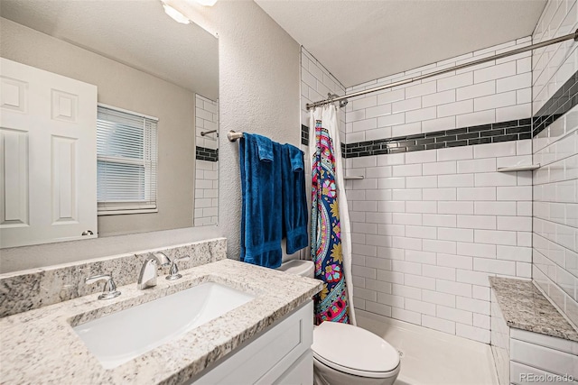 7005 Zenobia Pl, Westminster, CO 80030 - bathroom with toilet, a textured wall, a tile shower, and vanity