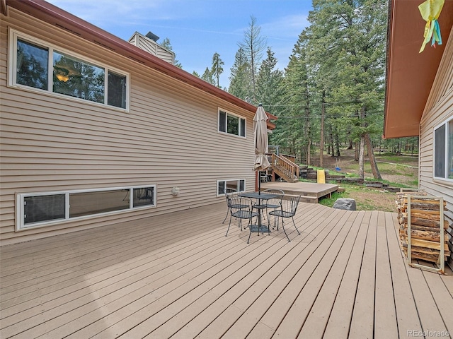 7585 Native Dancer Trl, Evergreen, CO 80439 - wooden deck with outdoor dining space