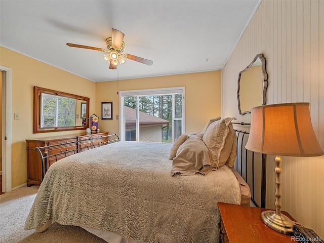 7585 Native Dancer Trl, Evergreen, CO 80439 - bedroom featuring multiple windows, carpet flooring, ceiling fan, crown molding, and access to exterior