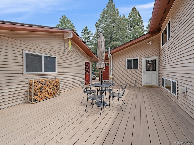 7585 Native Dancer Trl, Evergreen, CO 80439 - wooden deck featuring outdoor dining space