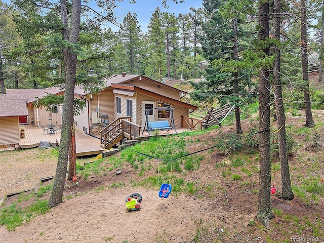 7585 Native Dancer Trl, Evergreen, CO 80439 - back of property featuring a wooden deck