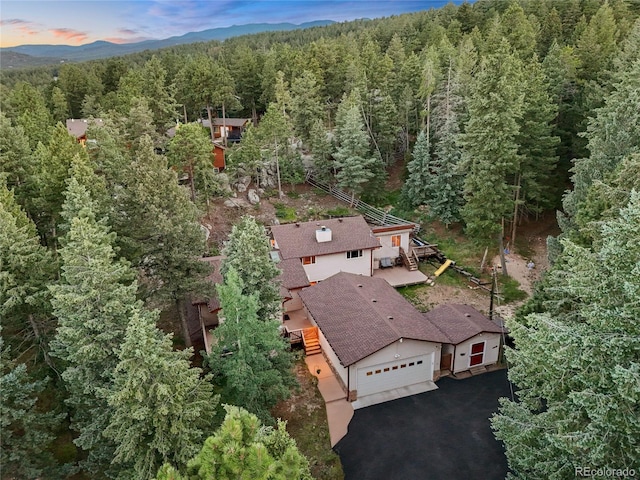 7585 Native Dancer Trl, Evergreen, CO 80439 - aerial view of property and surrounding area featuring a heavily wooded area