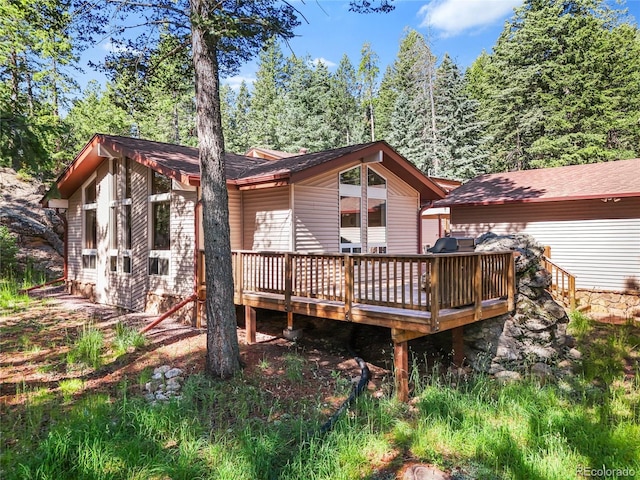 7585 Native Dancer Trl, Evergreen, CO 80439 - back of house with a deck