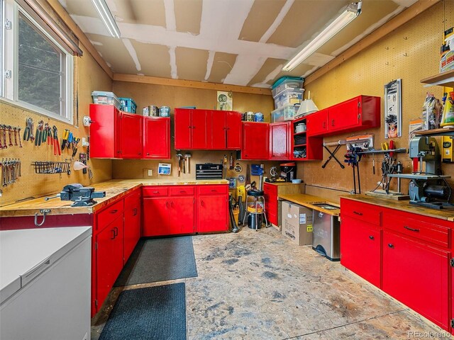 7585 Native Dancer Trl, Evergreen, CO 80439 - kitchen with red cabinets and light countertops