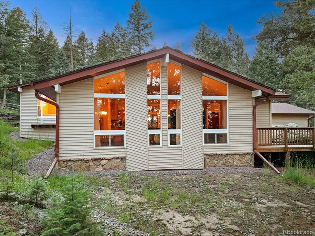 7585 Native Dancer Trl, Evergreen, CO 80439 - rear view of house with a deck
