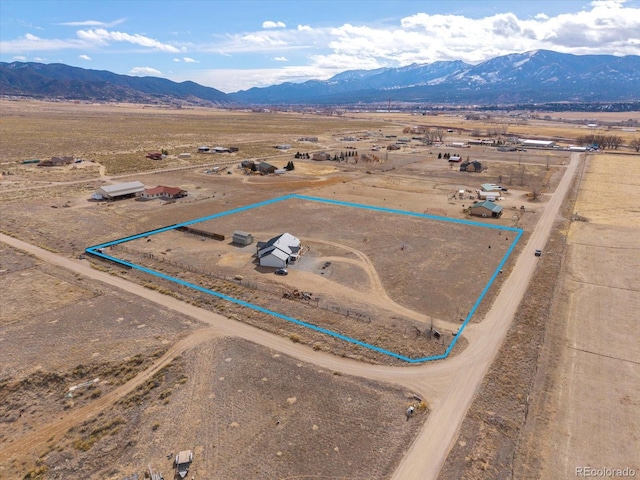 aerial view with a mountain view and a rural view