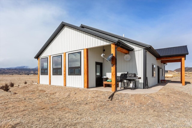 rear view of property featuring a patio