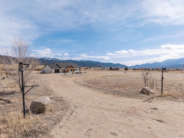 view of mountain feature with a rural view