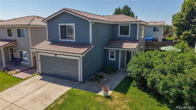21570 E 40th Pl, Denver, CO 80249 - view of front of property with a tile roof, a garage, and driveway