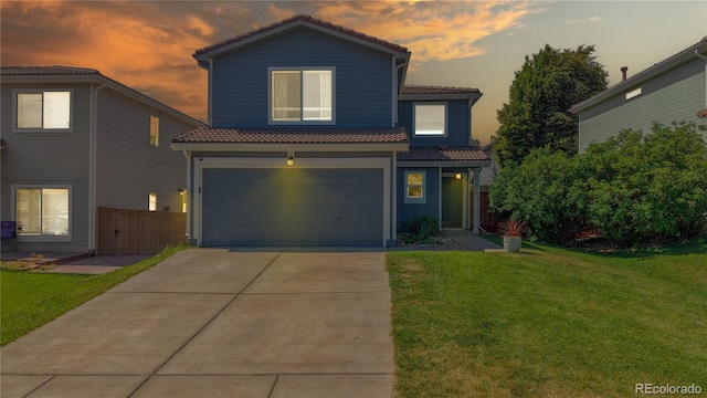 21570 E 40th Pl, Denver, CO 80249 - view of front facade with a tile roof, a garage, and concrete driveway