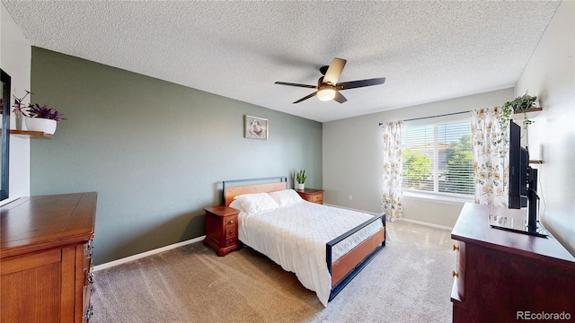 21570 E 40th Pl, Denver, CO 80249 - bedroom with light colored carpet, a ceiling fan, and a textured ceiling