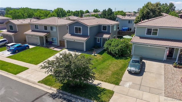 21570 E 40th Pl, Denver, CO 80249 - view of front of home featuring driveway, a residential view, a garage, and a tile roof