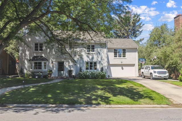 435 Ivanhoe St, Denver, CO 80220 - view of front of home with driveway, a garage, a front yard, and stucco siding