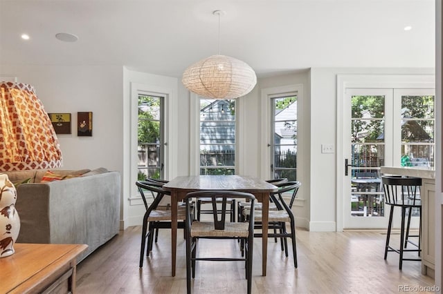 435 Ivanhoe St, Denver, CO 80220 - dining space with light wood-style flooring and recessed lighting