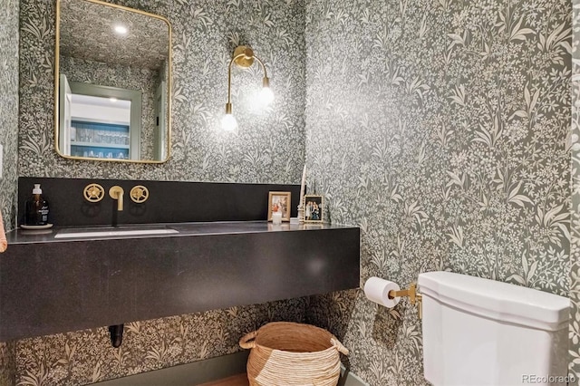 435 Ivanhoe St, Denver, CO 80220 - bathroom featuring wallpapered walls and toilet